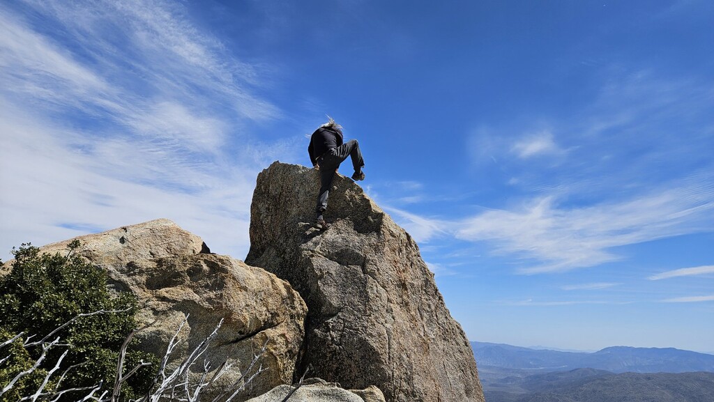 Sean climbing the summit block.